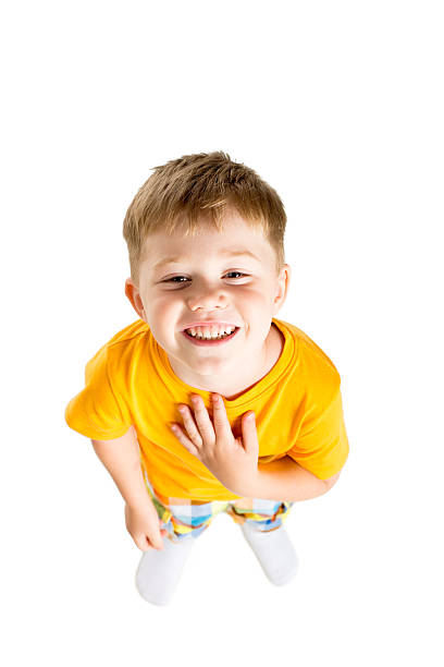 little boy looking up smiling stock photo