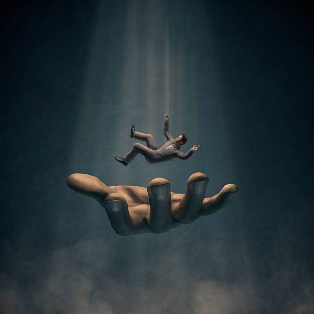 Catch my fall 3D render of businessman in suit falling into large hand man hand down stock pictures, royalty-free photos & images