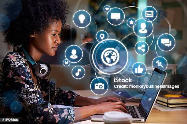 Young Woman On Social Media With Holographic Icons Stock Photo - Download Image Now - Community, African Ethnicity, Internet