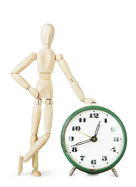 istock Man leaned his hand on the huge old retro clock 511928428