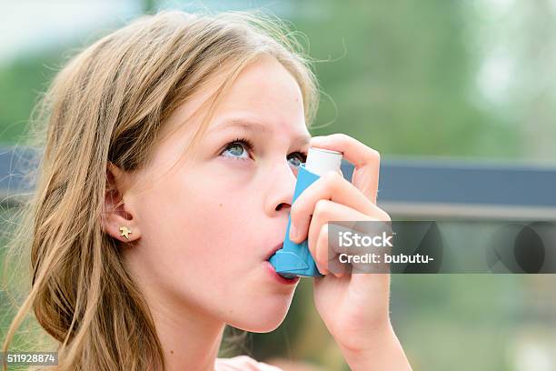 Pretty Girl Using Asthma Inhaler Stock Photo - Download Image Now - Child, Asthma Inhaler, Asthmatic