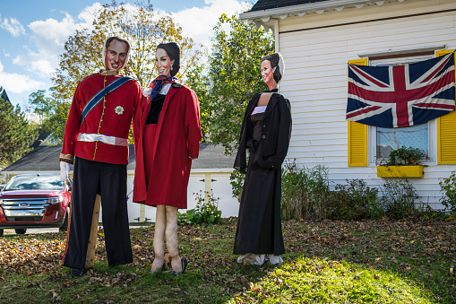 Mahone Bay, Canada - October 9, 2014: Figures (Royal Family) at the annual scarecrow festival. Figures of different motives are placed in the streets all over the town.