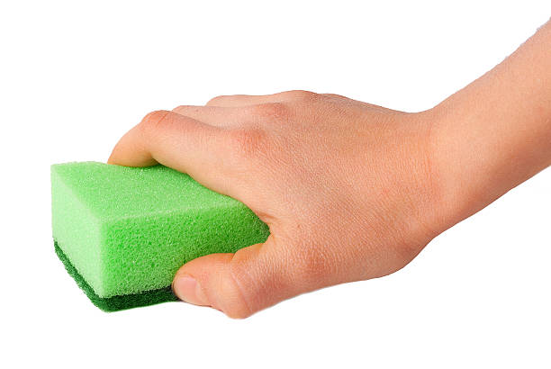 istock sponge for washing dishes in hand isolated 511929764