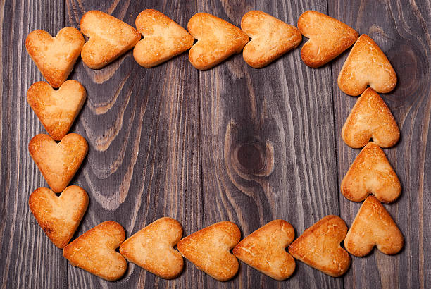 istock frame from heart shaped cookies on wooden table 511931978
