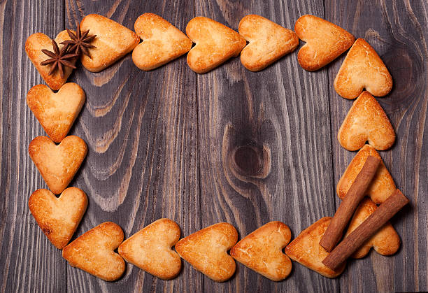 istock frame from heart shaped cookies on wooden table 511932134