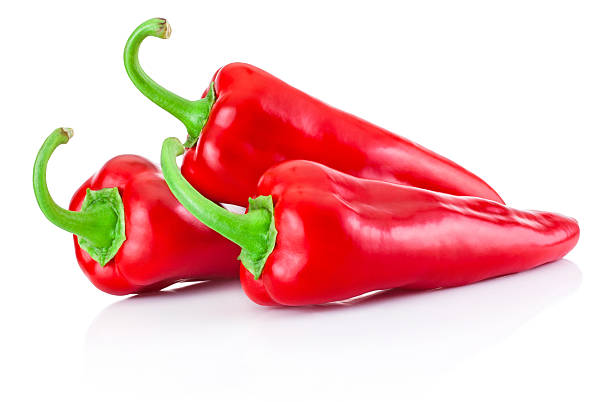 istock Three red hot peppers isolated on white background 511932806