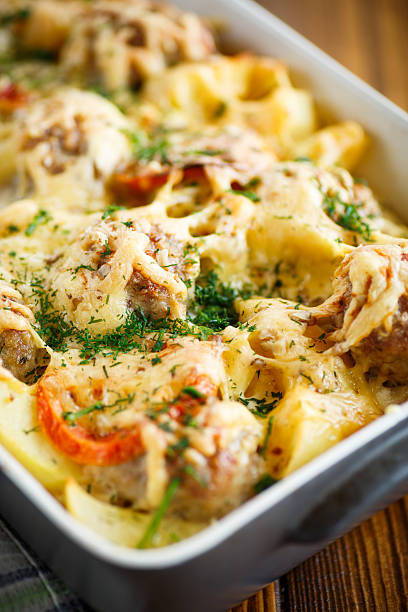 Vegetable casserole with potatoes and meatballs in a ceramic form