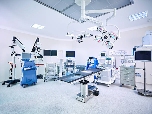 Modern hospital operating room with monitors and equipment Hospital operating room with monitors and equipment medical instrument stock pictures, royalty-free photos & images