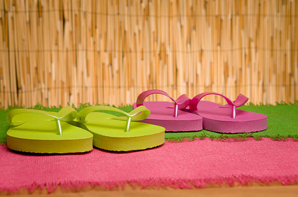 Stock photo of flip flops on textured background