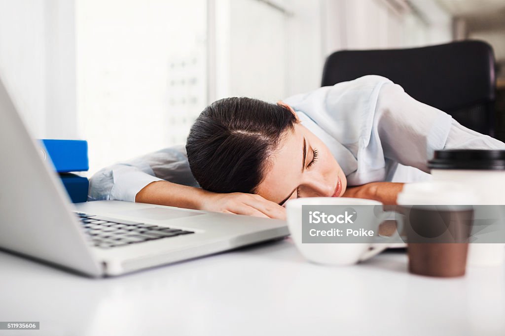Tired woman in the office Tired businesswoman in the office Sleeping Stock Photo