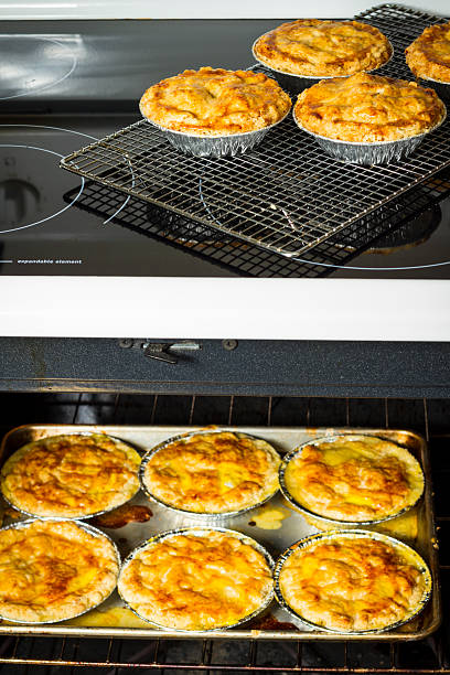 istock Chicken Pot Pies Cooling On A Rack On The Stovetop 511937336