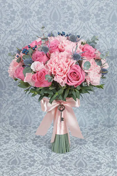 Photo of Pink bridal bouquet  isolated on gray background