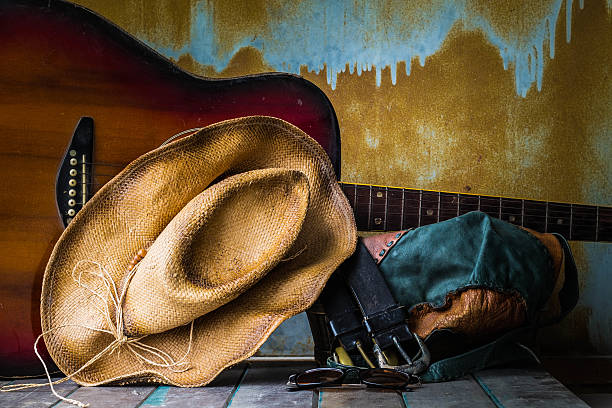 istock Hat and guitar on wooden 511940844