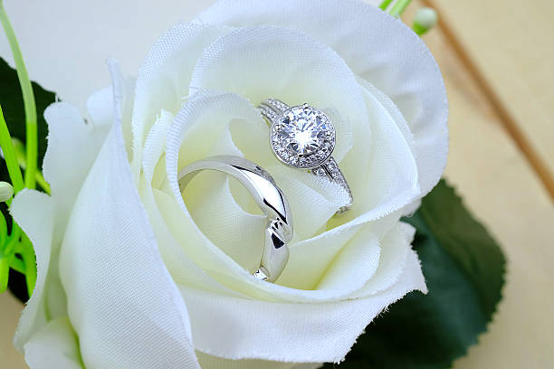 istock wedding rings with rose flowers 511941000