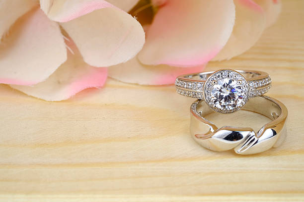istock wedding rings with rose flowers 511941154