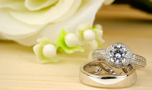 istock wedding rings with rose flowers 511941804