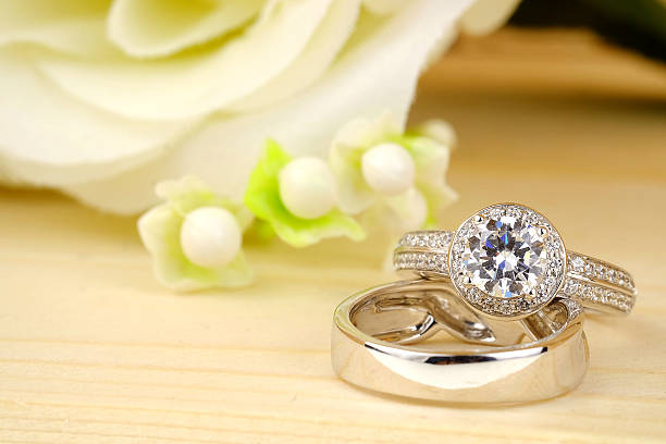 istock wedding rings with rose flowers 511941840
