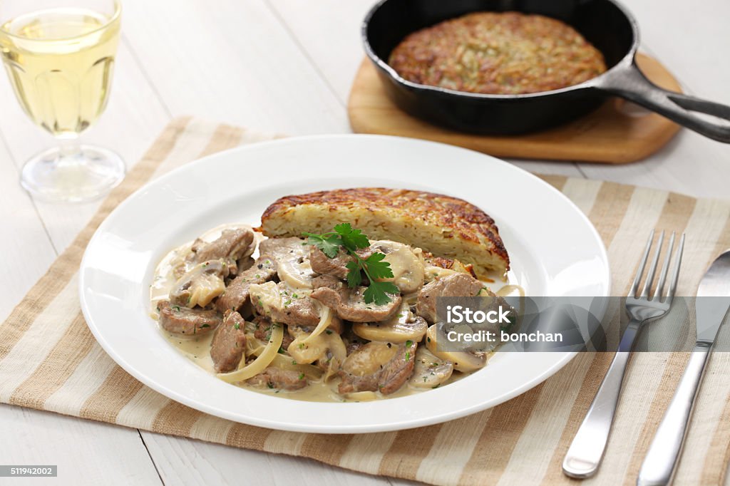 Zurich style veal stew and rosti potato Zurich style veal stew and rosti potato, Swiss cuisine Chopped Food Stock Photo