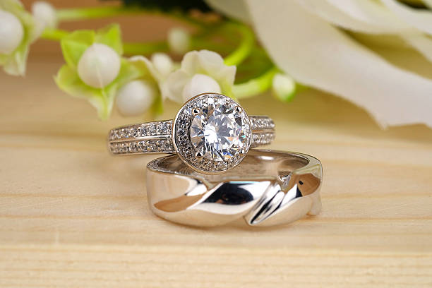 istock wedding rings with rose flowers 511942276