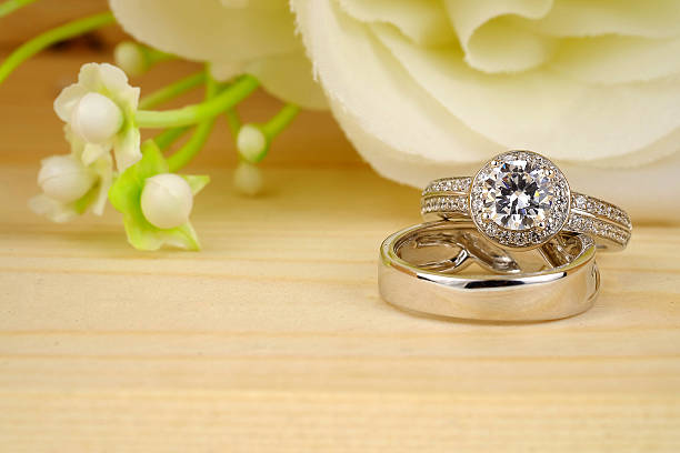 istock wedding rings with rose flowers 511942626