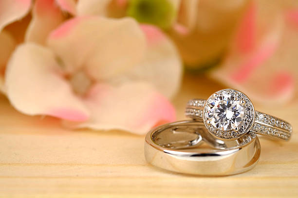 istock wedding rings with rose flowers 511942676