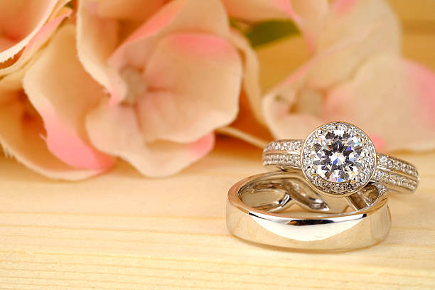 istock wedding rings with rose flowers 511942702