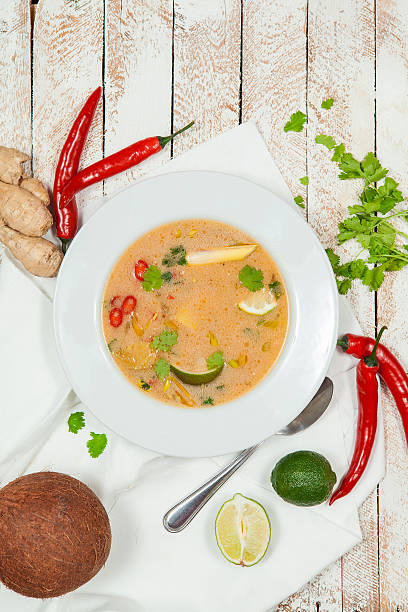 istock Tom Yam soup on white wooden background 511943214