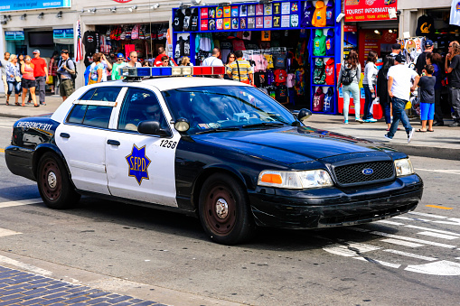San Francisco, CA, USA - July 7, 2015: Black and white Police car of the San Francisco Police Department on Jefferson Street