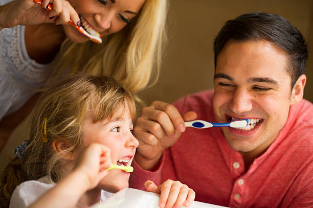 istock young family brushing teeth 511946425