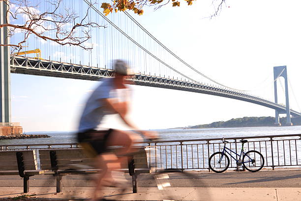 istock Rider and Verrazano-Narrow Bridge 511947463