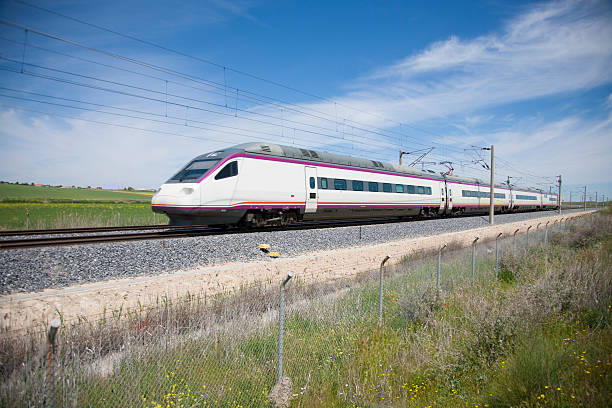 high speed train railway with high speed train at a landscape in Spain high speed train photos stock pictures, royalty-free photos & images