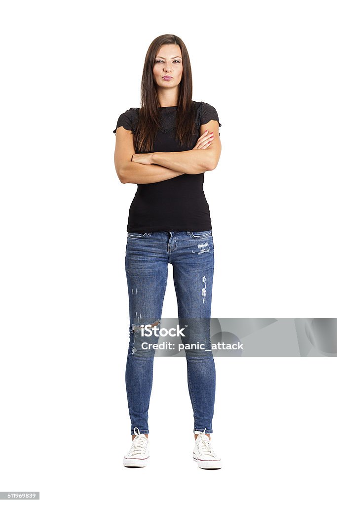 Confident unhappy woman with crossed or folded arms. Confident unhappy woman with crossed or folded arms. Full body length isolated over white. Women Stock Photo
