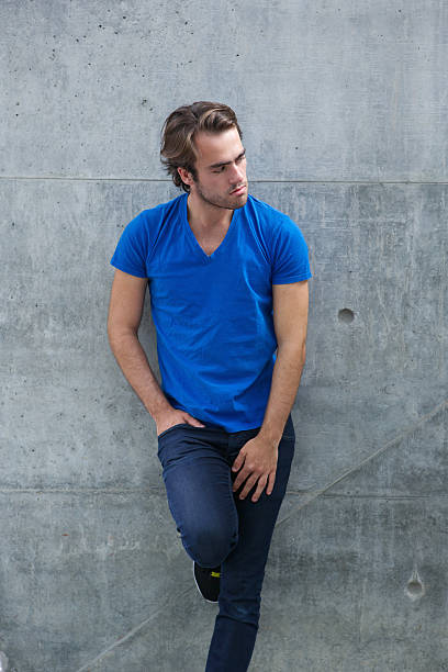 istock Male fashion model posing outside 511971859