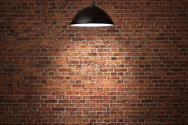 Photo of Illuminated birick wall background