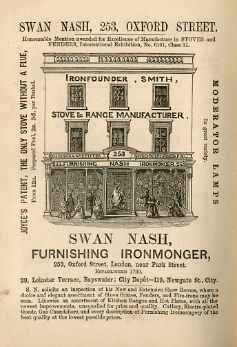 London, England - December 5, 2015: Advertisement showing the exterior of the showroom of Swan Nash, Furnishing Ironmonger, of 253 Oxford Street, London - part of an advertisement section in “Peter Parley’s Annual for 1865”, William Kent & Co, 1864. The showroom contains luxury items such as baths, perdoniums, kettles, lamps, fireplaces, chests etc. 