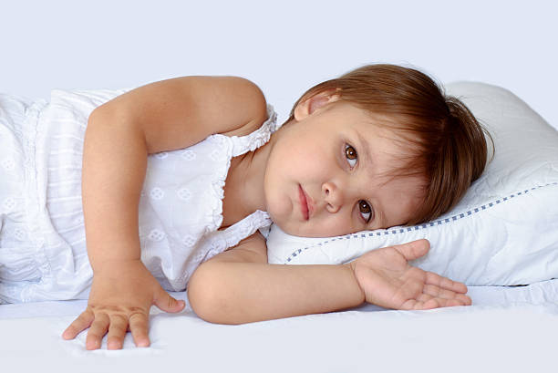 Little girl sleeping on pillow stock photo