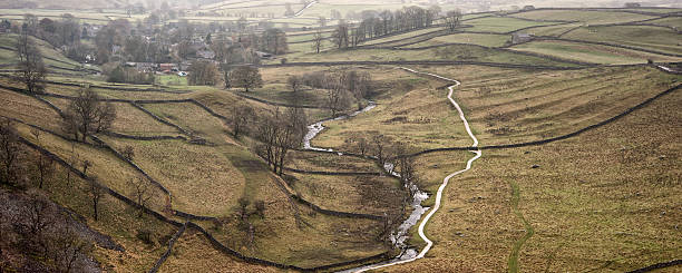 istock Panorama landscape stream running through valley in Autumn 511977399