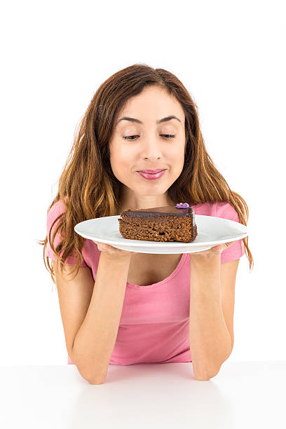 istock Woman with a piece of cake 511977876