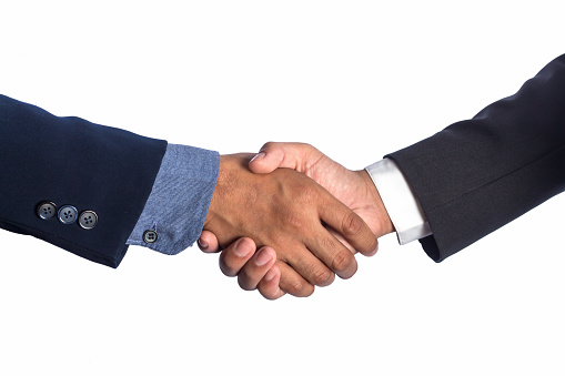 B2B partnership, collaboration or client handshake in business meeting for welcome, onboarding or thank you. Agency team shaking hands and happy with agreement, deal or negotiation strategy interview