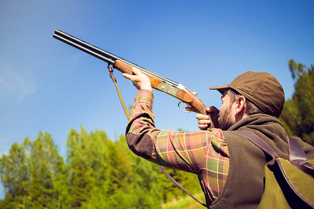 istock Hunter Pointing a Gun to the Sky 511978888