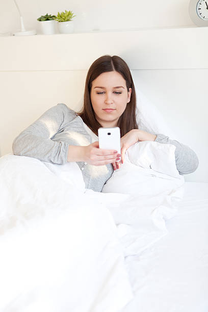istock Young woman using cell phone 511982726