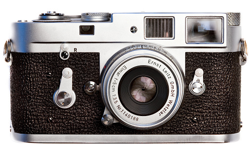 Montreal, Canada - February 23, 2016 : Leica classic and vintage M2 film camera circa 1957-67 seen from the front with lens cap off.