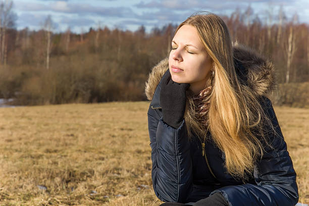 istock Happy, young girl sunbathing her face in sunny spring. 511982992