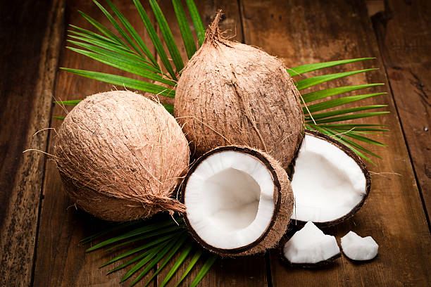 istock Coconut on wooden table 511984574