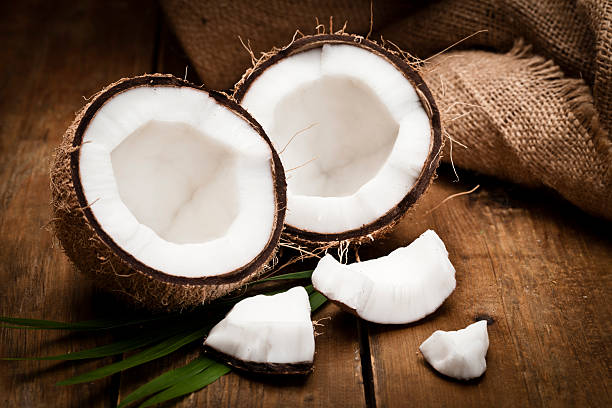 istock Coconut on wooden table 511984822