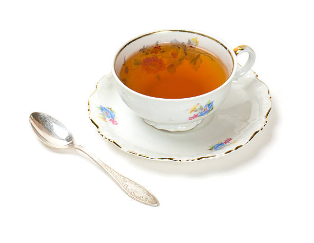 istock tea in vintage cup isolated on white 511988682