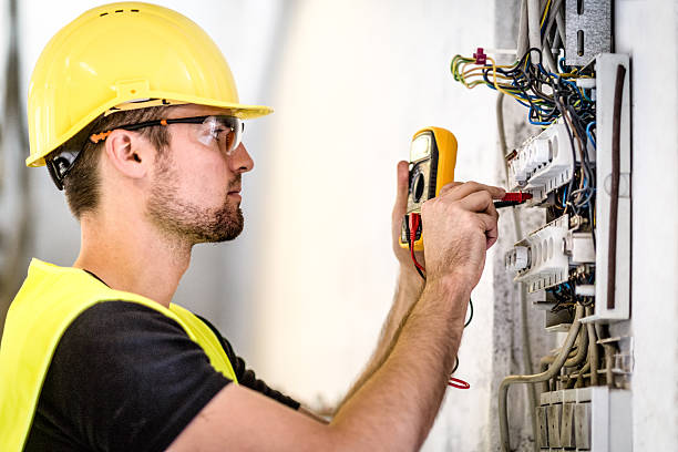 Industrial electric panel repair Electrician repairing circuit breakers in industrial electric panel. fuse box stock pictures, royalty-free photos & images