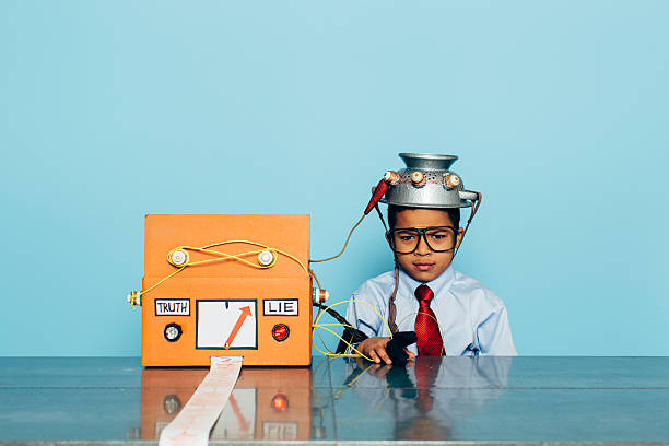 istock Young Dishonest Businessman with Lie Detector 511990878