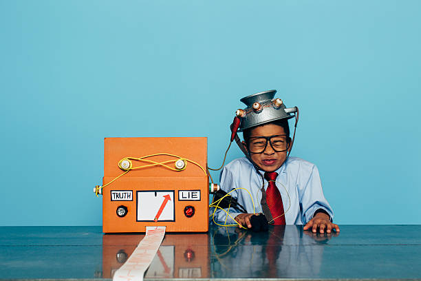 istock Young Dishonest Businessman with Lie Detector 511990898