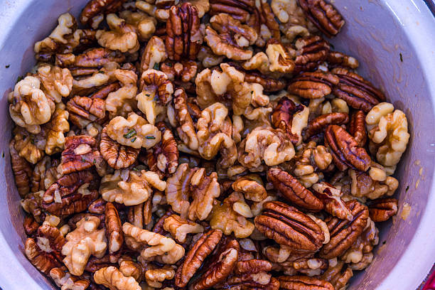 istock Mix nuts covered in butter garlic and rosemary mixture 511995026